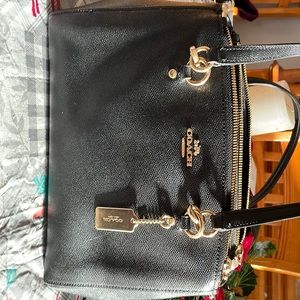 Like new coach black purse used briefly because of hands too hard for me